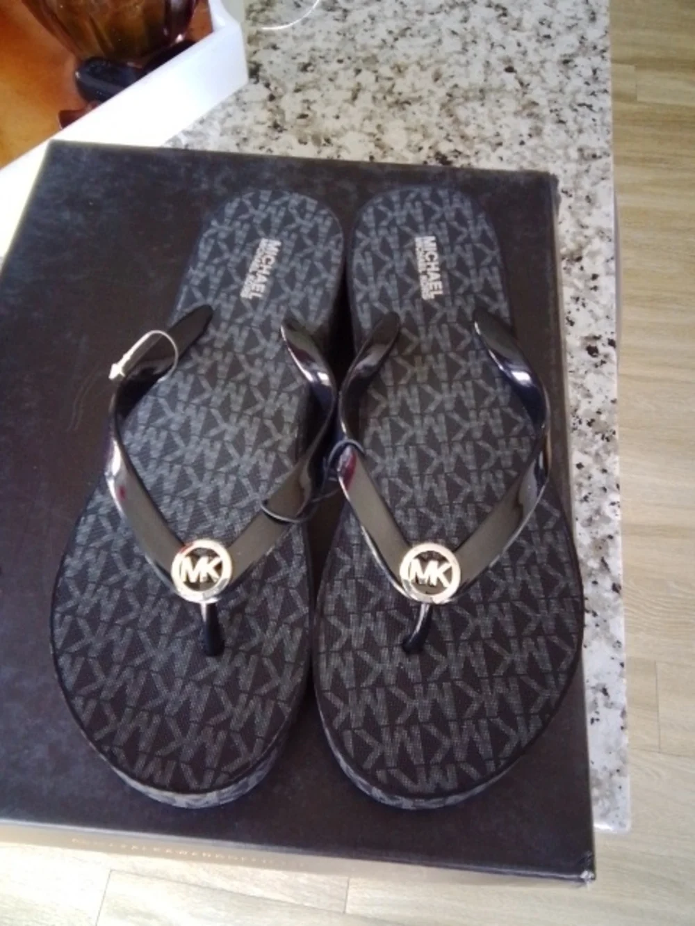 Michael Kors Black Flip Flops with Gold MK Medallions